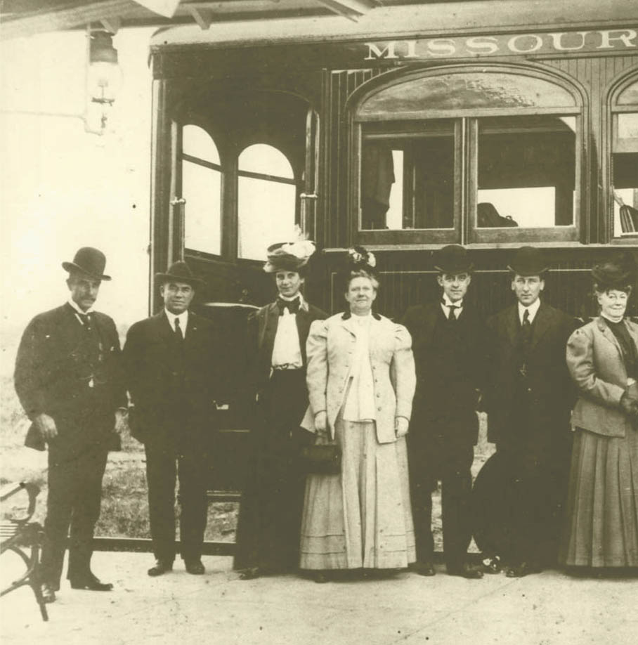 Group photo in front of train